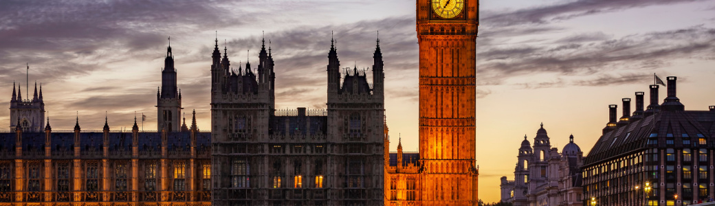 An external image of the Palace of Westminster in the evening