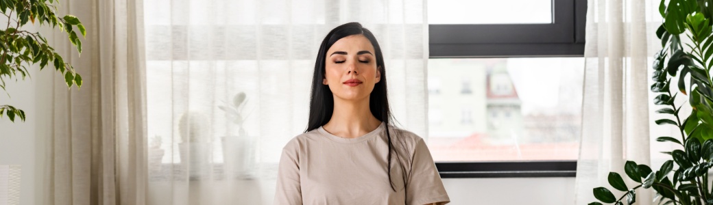 A woman meditating.