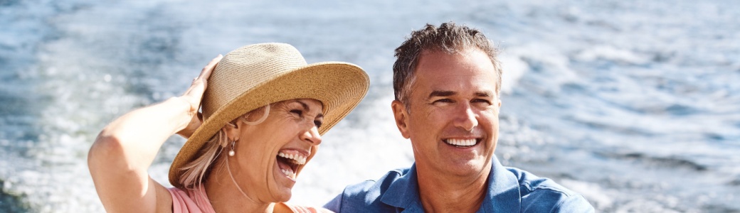 A couple on a yacht cruise.