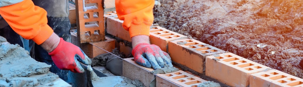 A bricklayer working on a construction site.