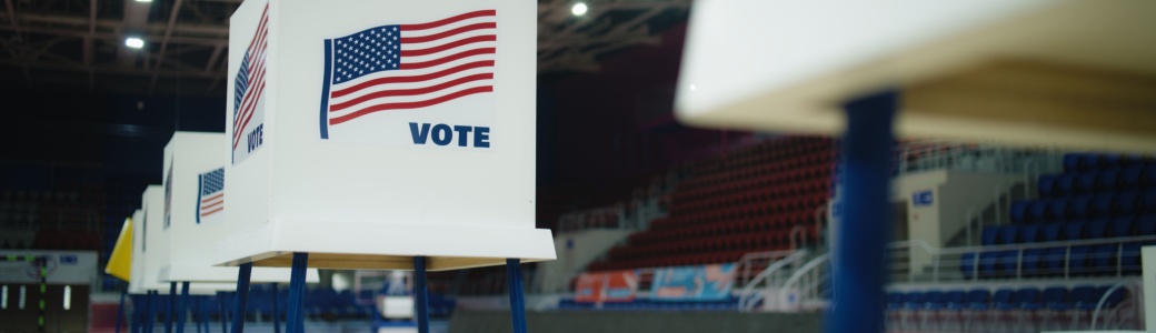 A voting booth with an American flag.