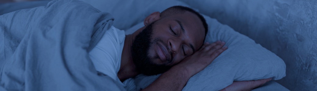 Man asleep in bed.