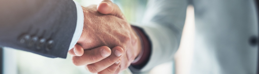 Two people shaking hands.