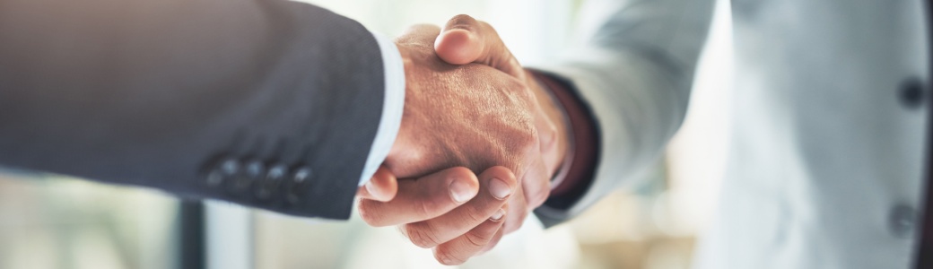 Two people shaking hands.